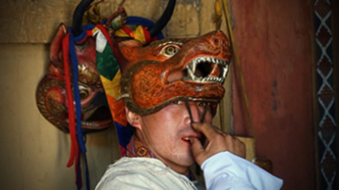 Monk preparing for Mask Dance, Ura, Bhutan Ura Monk